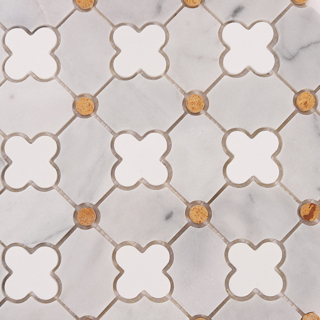 Close up of clover pattern with white insets, gray marble field, and gold dots