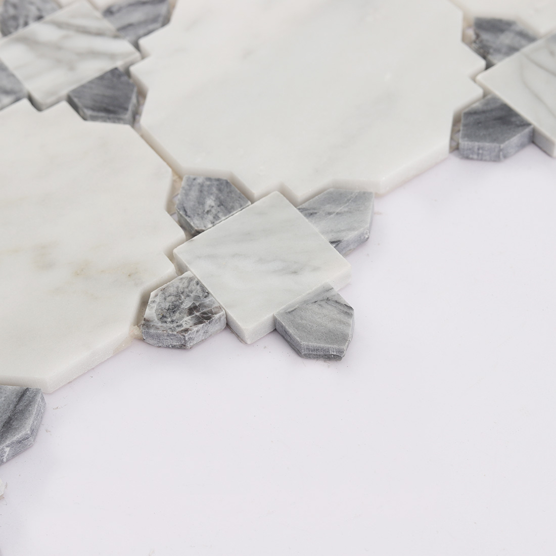 Side view showing thickness of white and gray marble mosaic tile