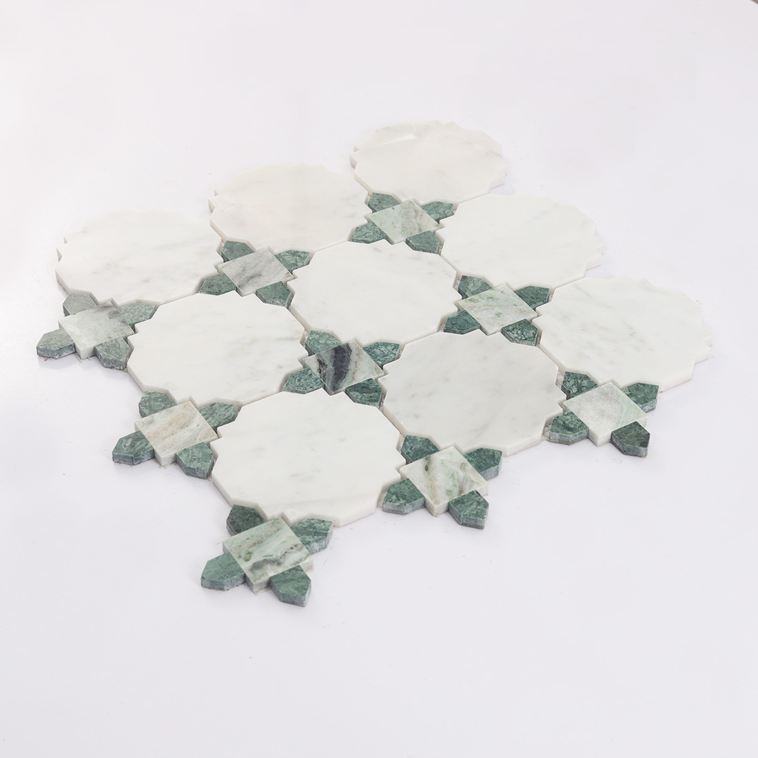 Side view of white octagon marble mosaic with green accent pieces