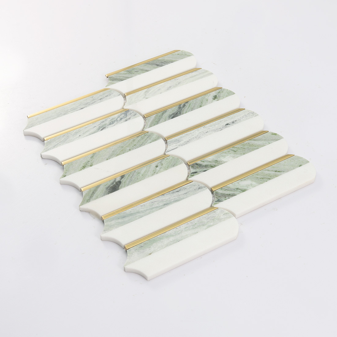 Angled display of white light green elongated marble mosaic with gold strips