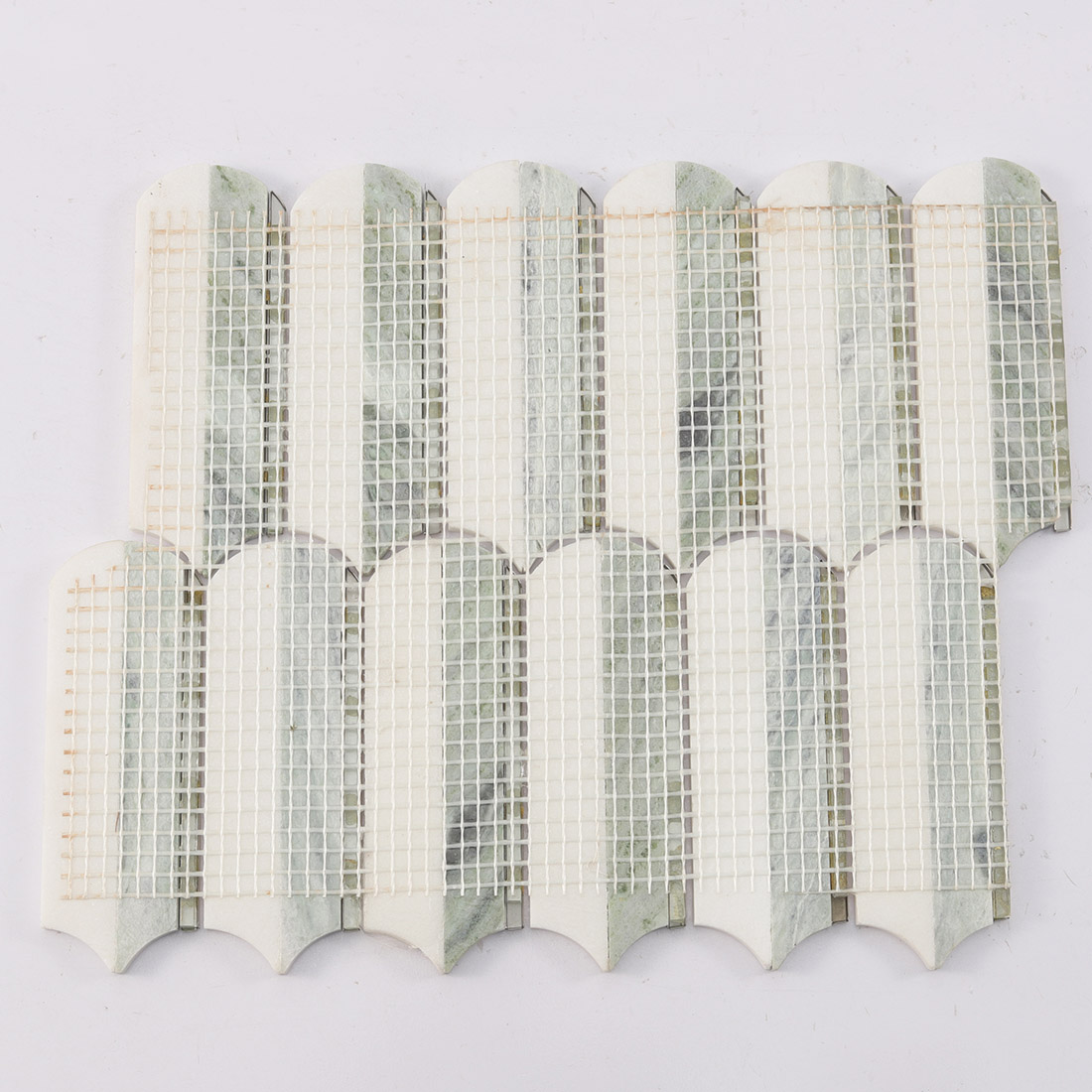 Back view of white light green marble mosaic tile sheet with mesh backing