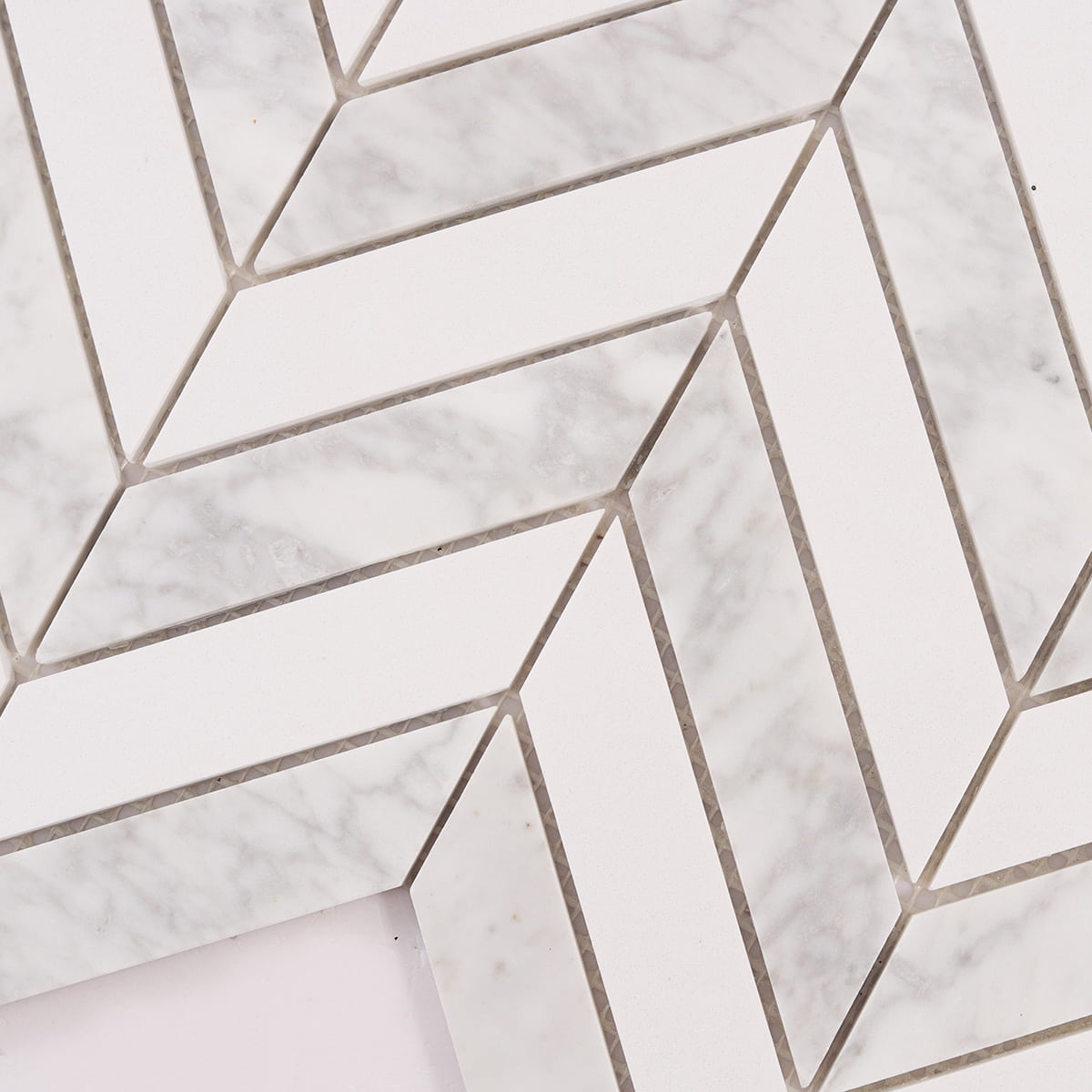 Macro view of white marble chevron pattern with veining strip details