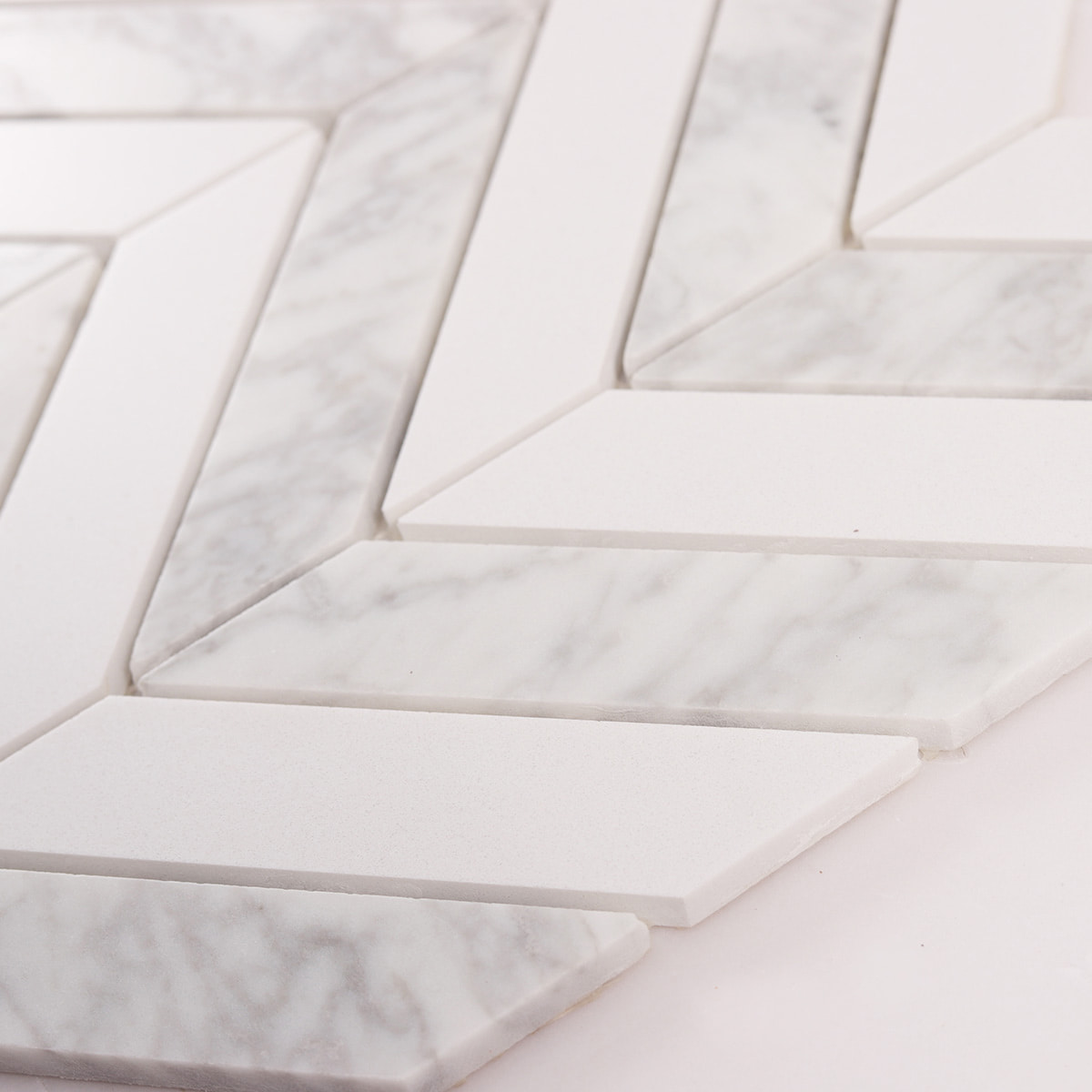 Close up of marble chevron pieces highlighting smooth surface and joints