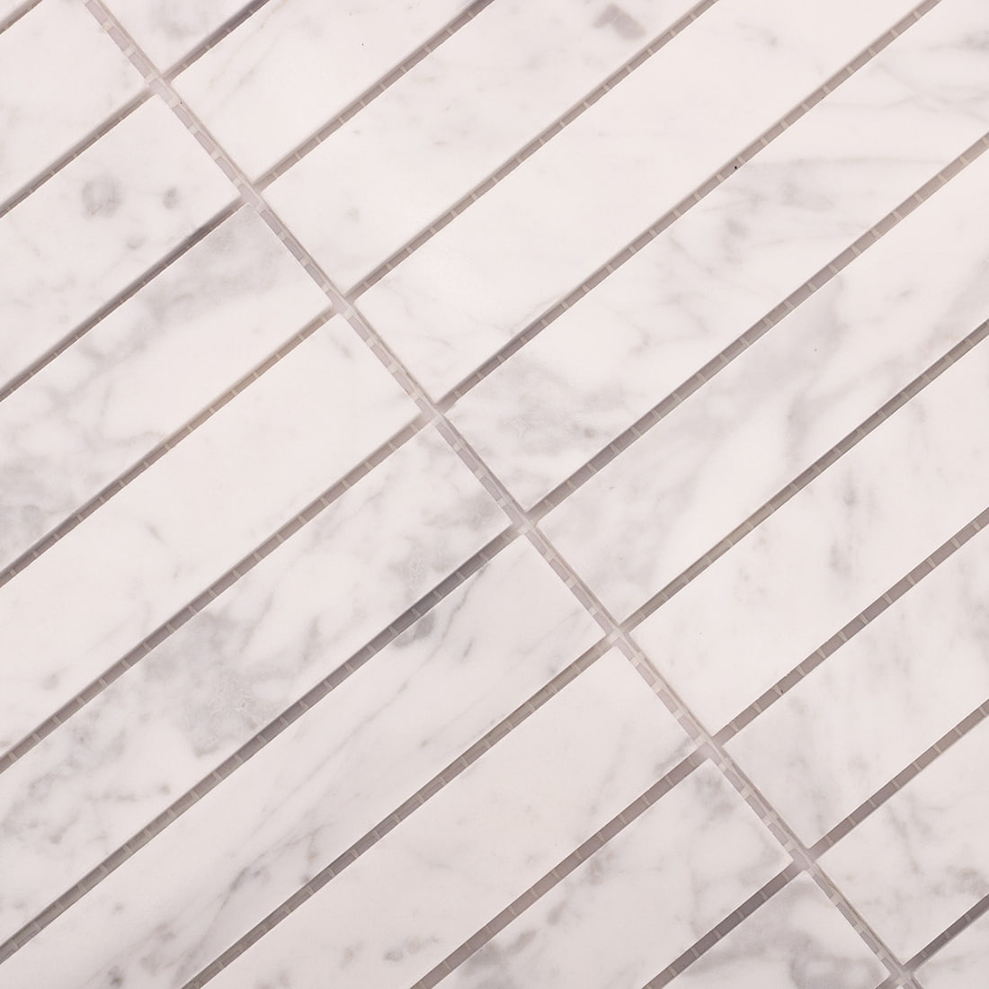 Close-up of white marble strip mosaic pattern with grout joints