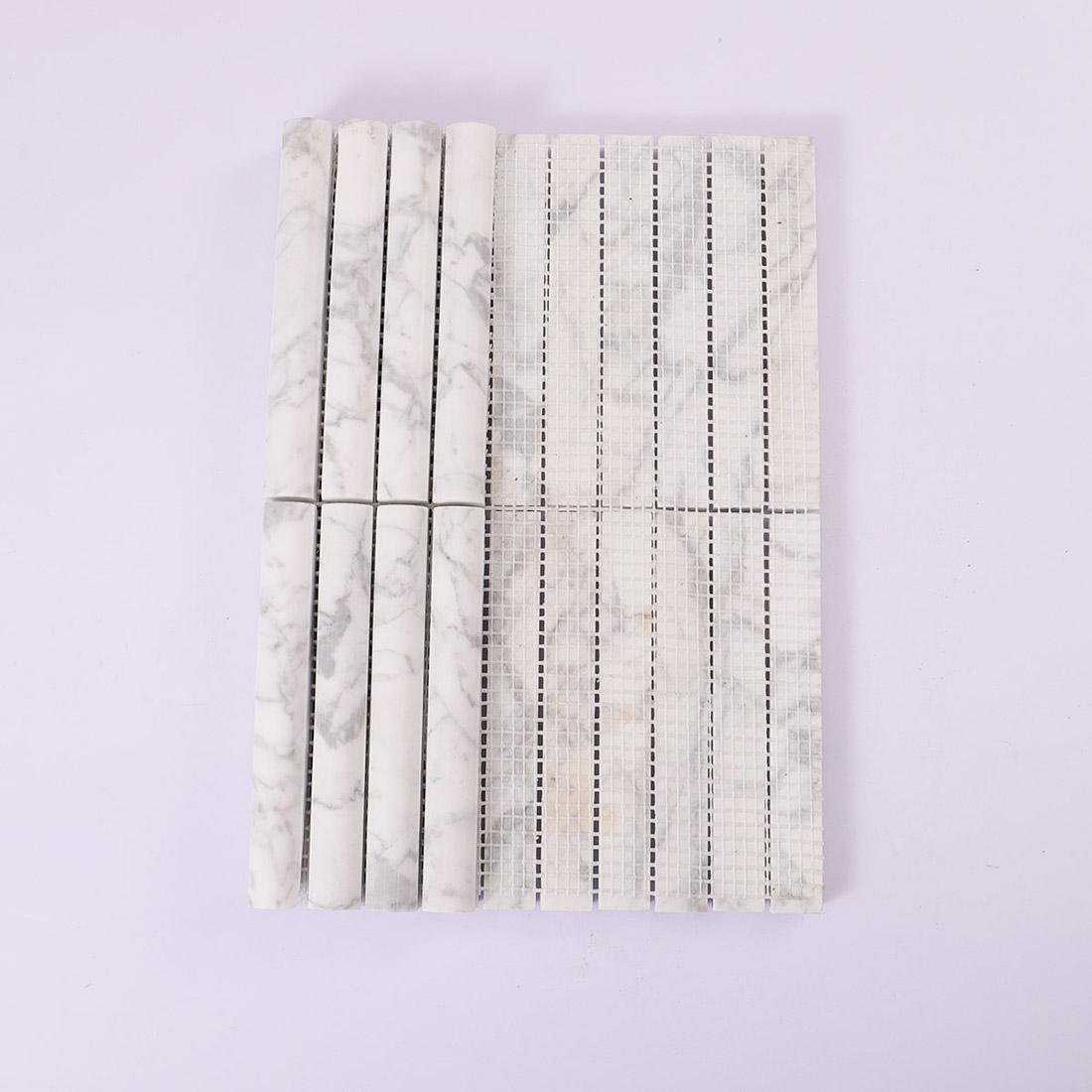 Front and mesh backing view of white marble half round mosaic tile