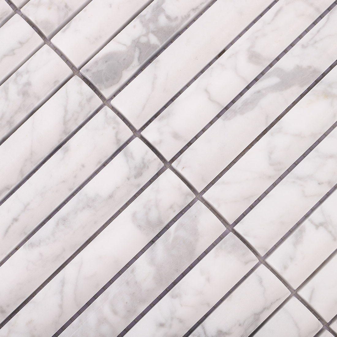 White marble linear mosaic showing spaced joints and varied gray veining