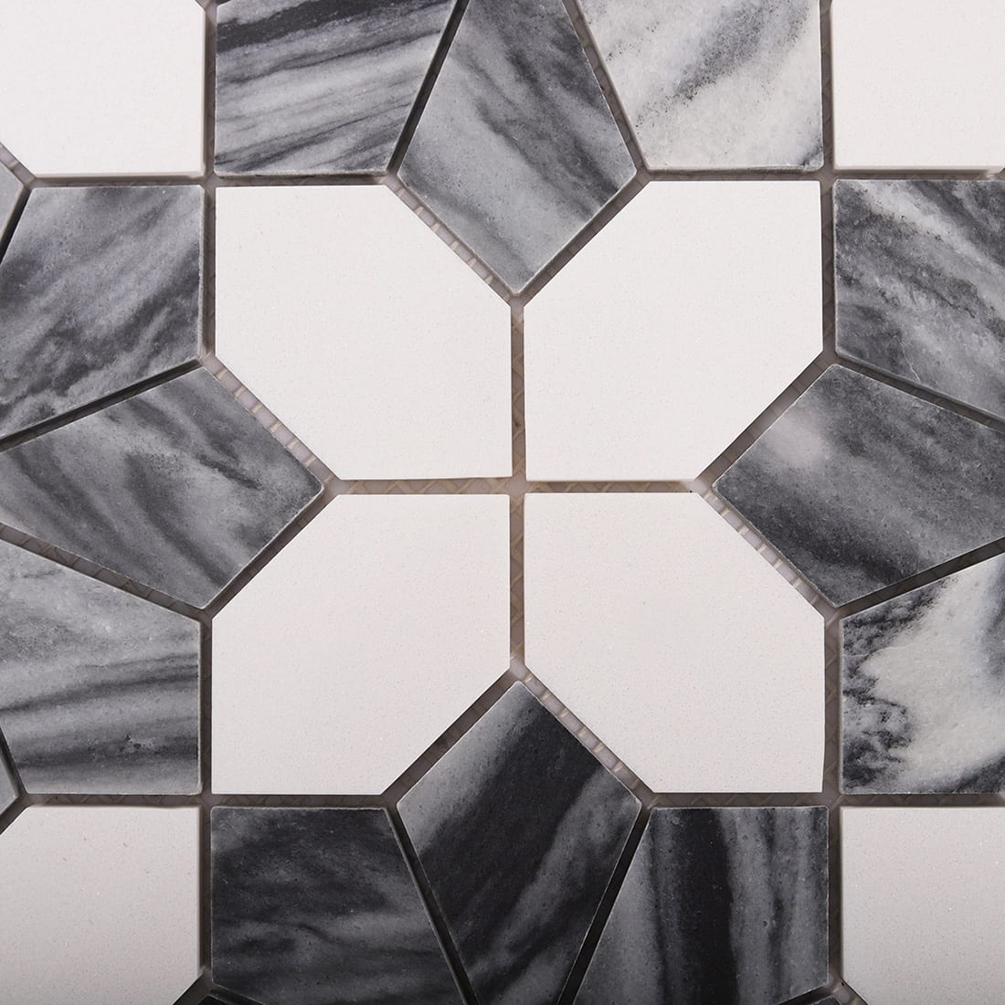 Close up of white octagon tiles with gray diamond and marble accents