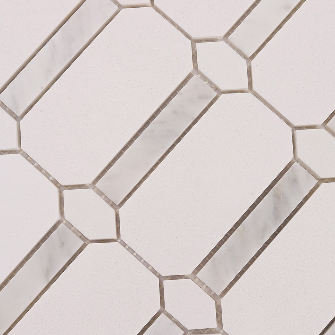 Top view detail of white octagon mosaic tile pattern with marble accents