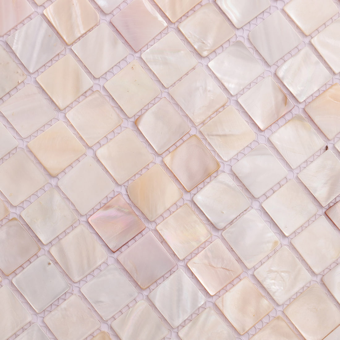 Closeup of pearl shell square mosaic tiles shown in diagonal layout