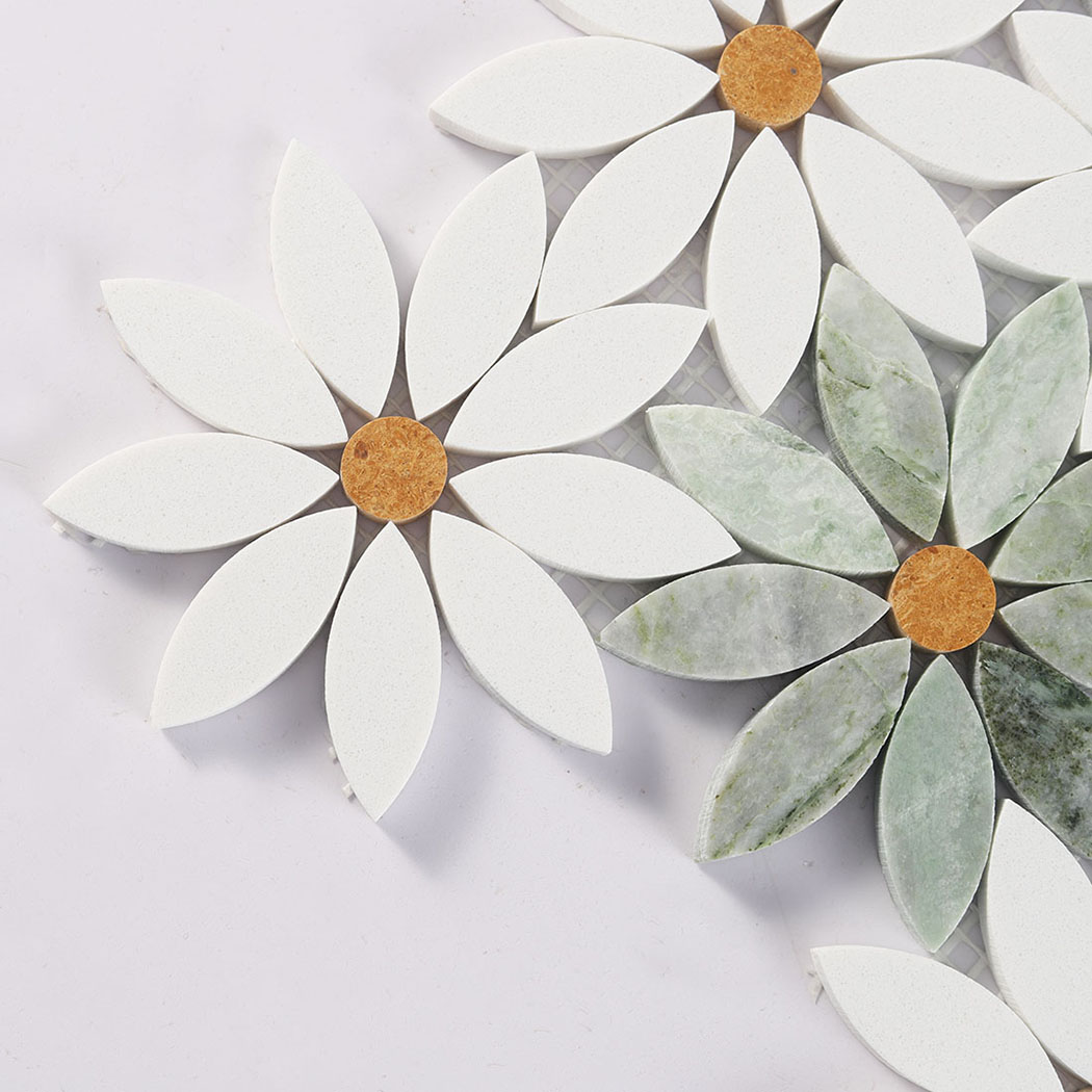 Close view of white and green daisy marble mosaic flowers with round gold centers
