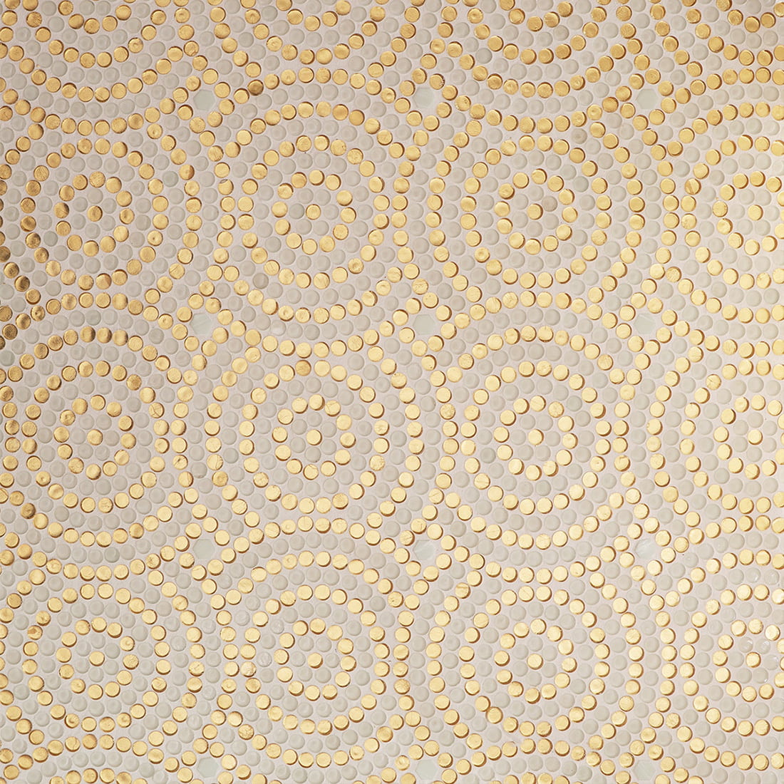 Repeating pattern of white and gold round glass mosaic tile installation