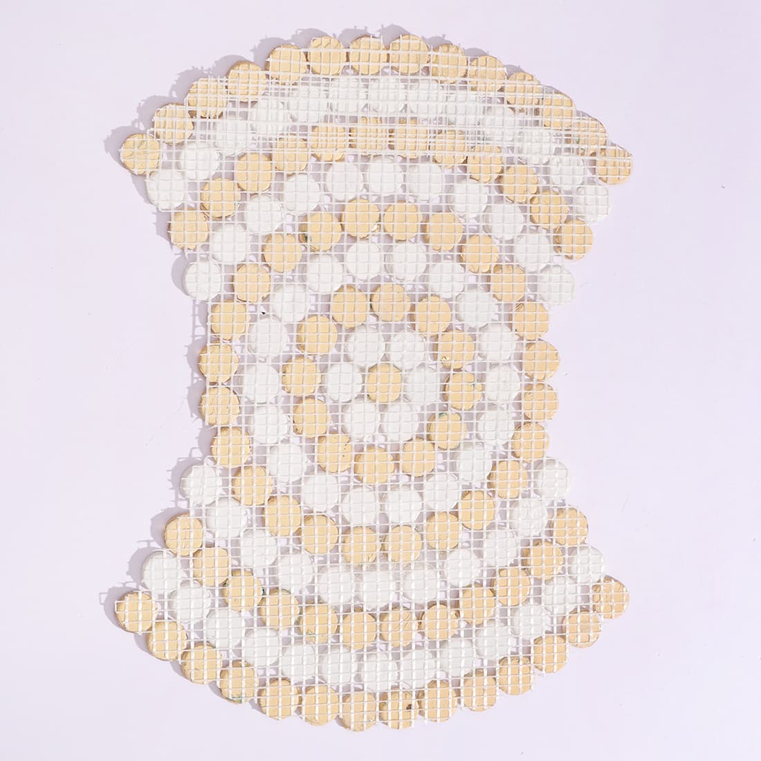 Back view of white and gold round glass mosaic sheet showing mesh backing