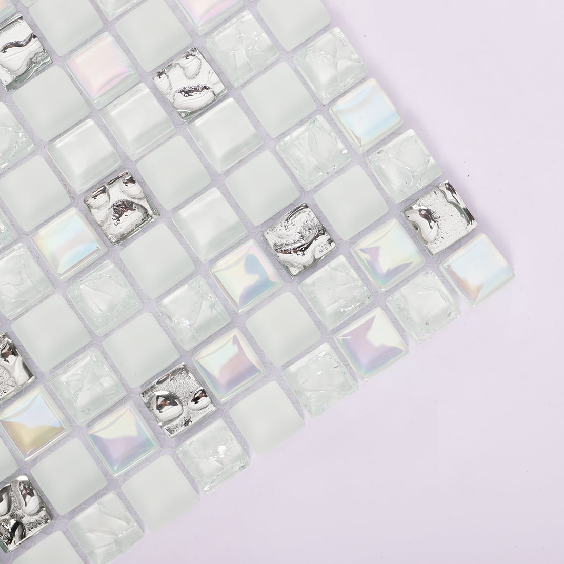 Corner detail of white iridescent glass mosaic tiles with silver accent squares