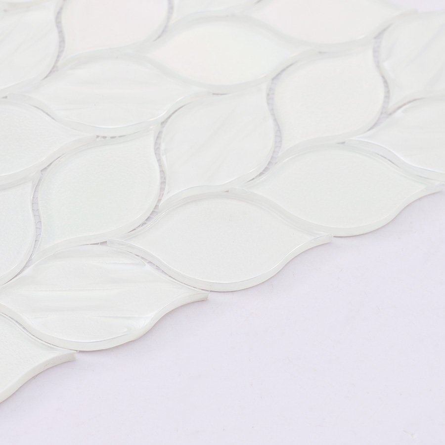 Edge detail of white glass iridescent leaf mosaic tile sheet.