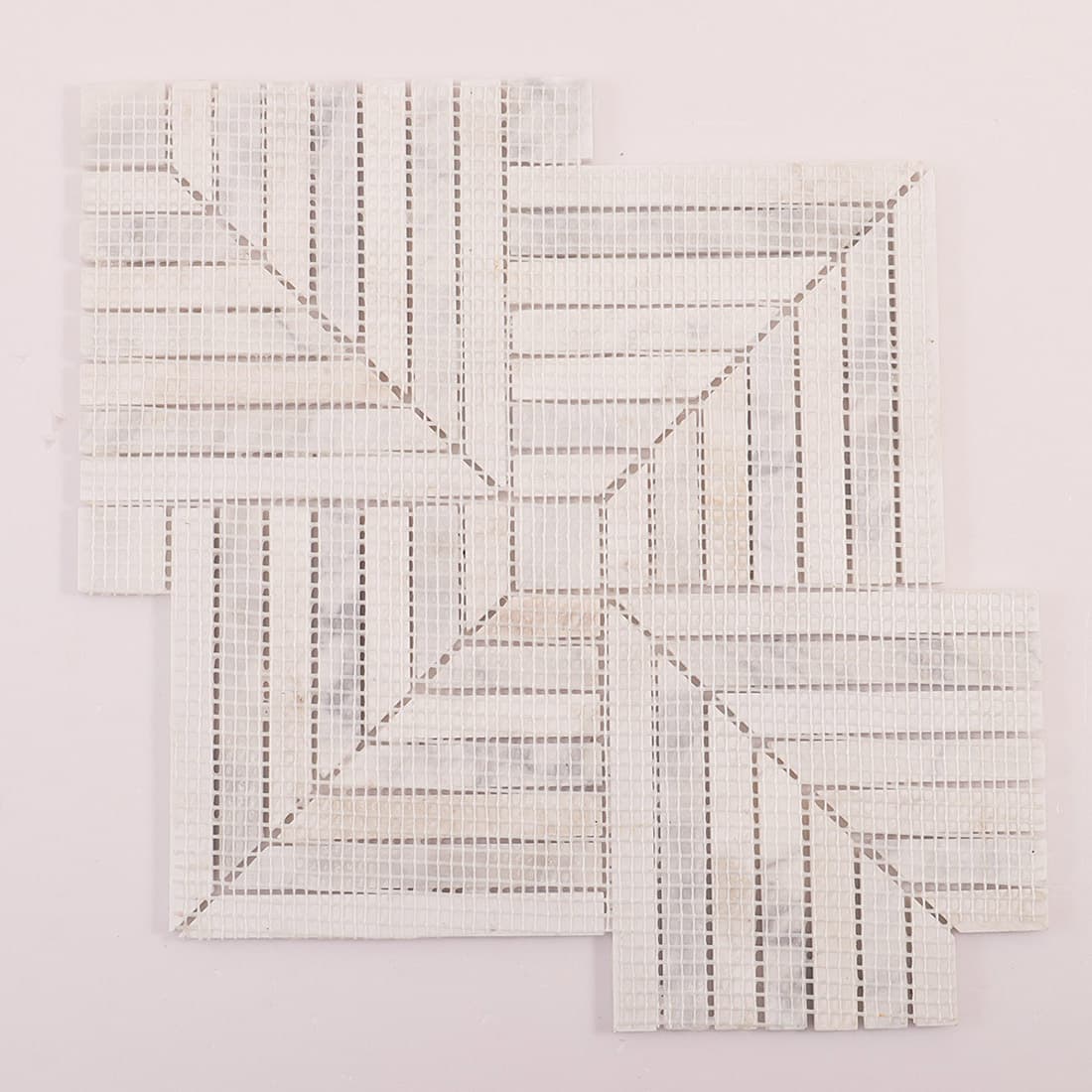 Rear view of white marble mosaic mounted on mesh backing, full sheet