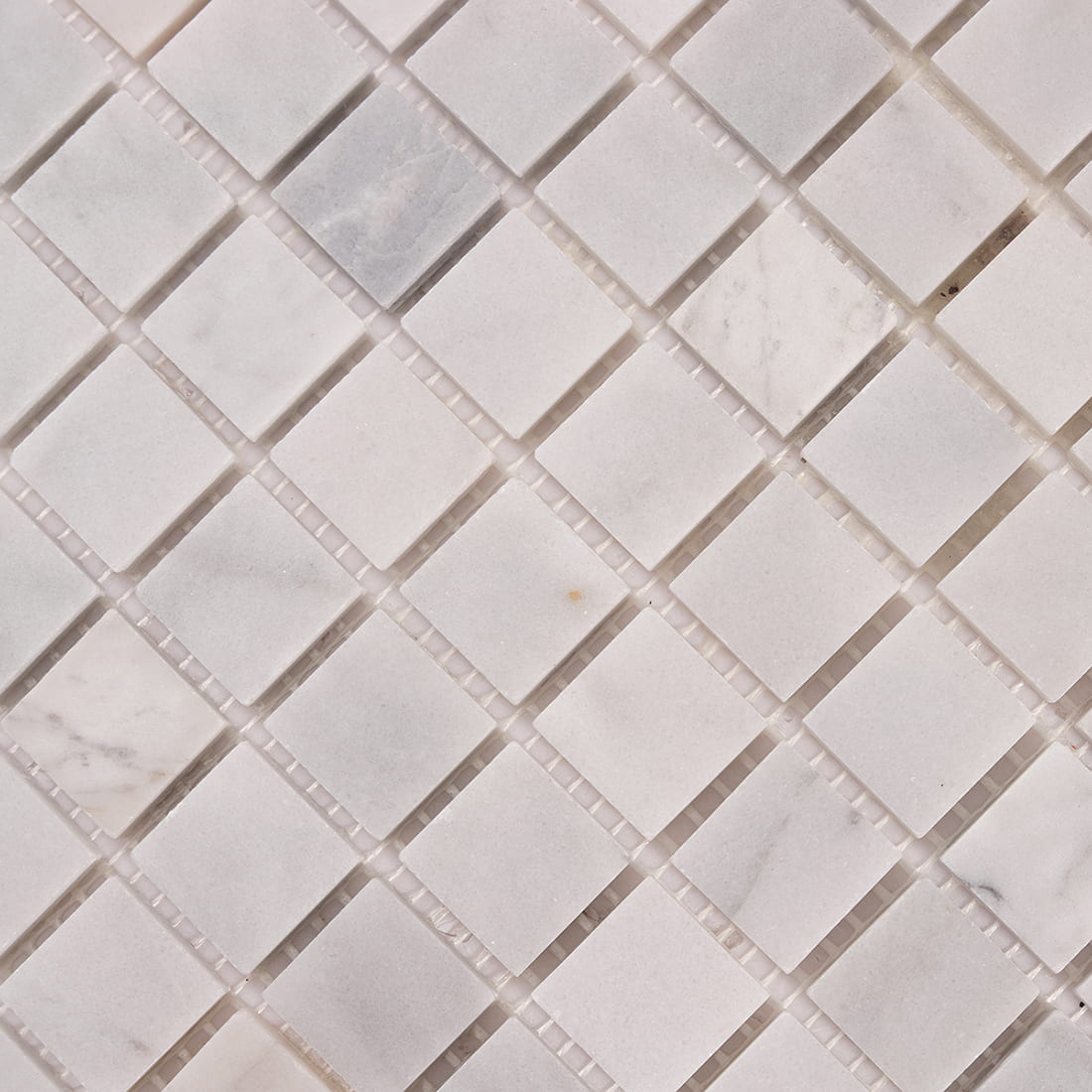 Close up texture of white marble square mosaic tiles