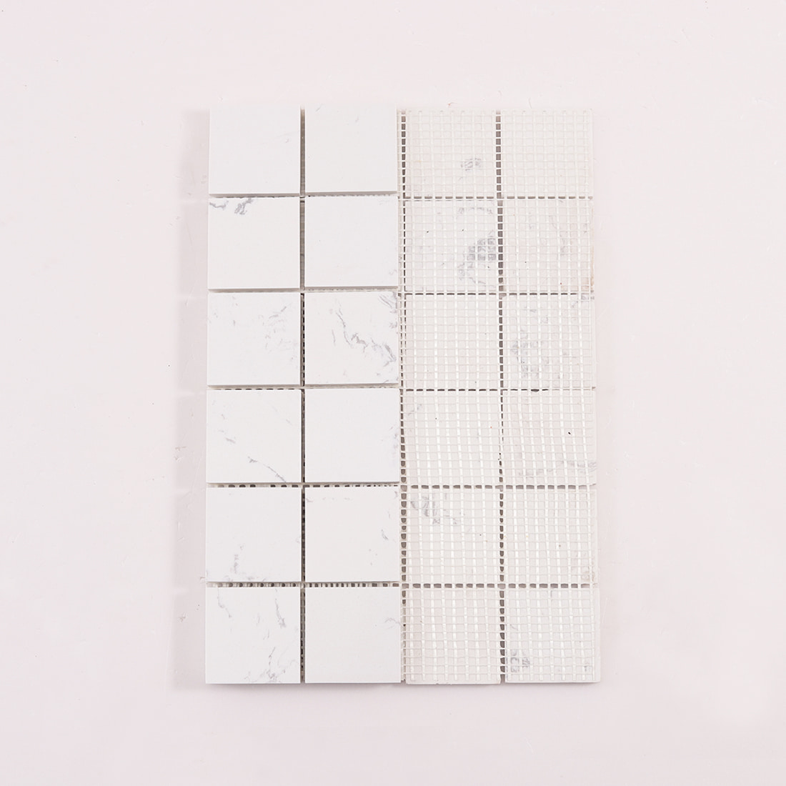 Back view of white marble square mosaic tiles mounted on mesh backing