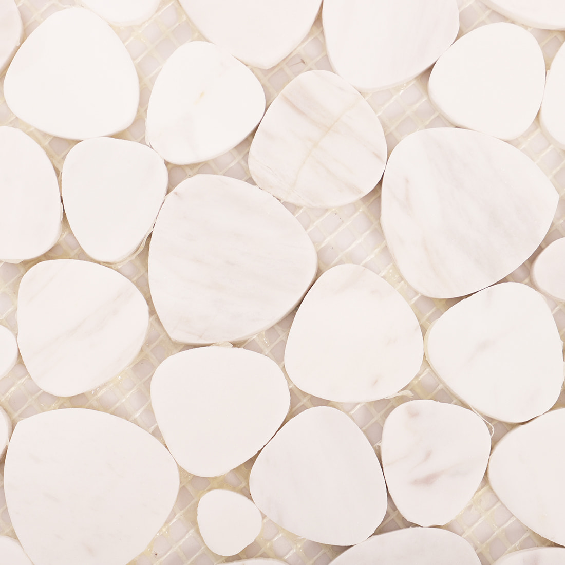 Close up texture of white marble pebble mosaic stones on mesh