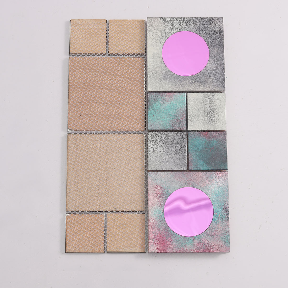 Aluminum mosaic tile showing mesh backing and pink round glass front inserts