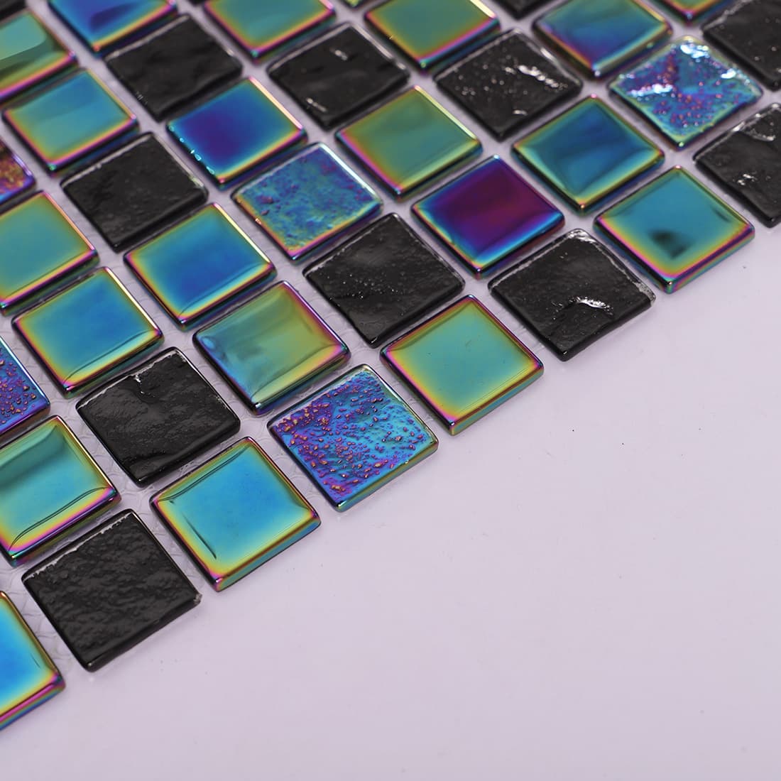 Angled view showing the edge and thickness of the iridescent mosaic tiles.