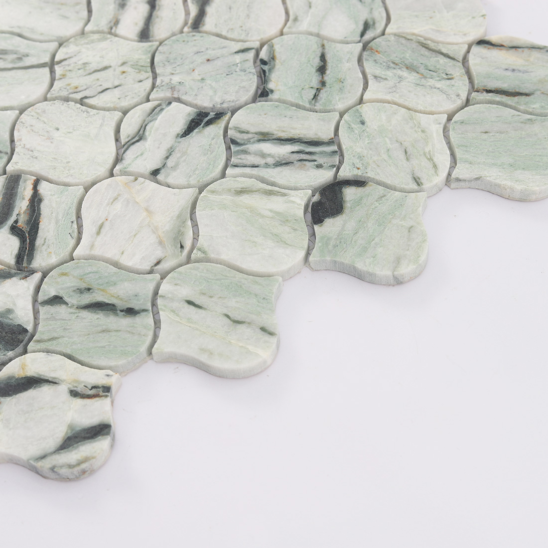 Side view of light green lantern marble mosaic tile with soft green tones