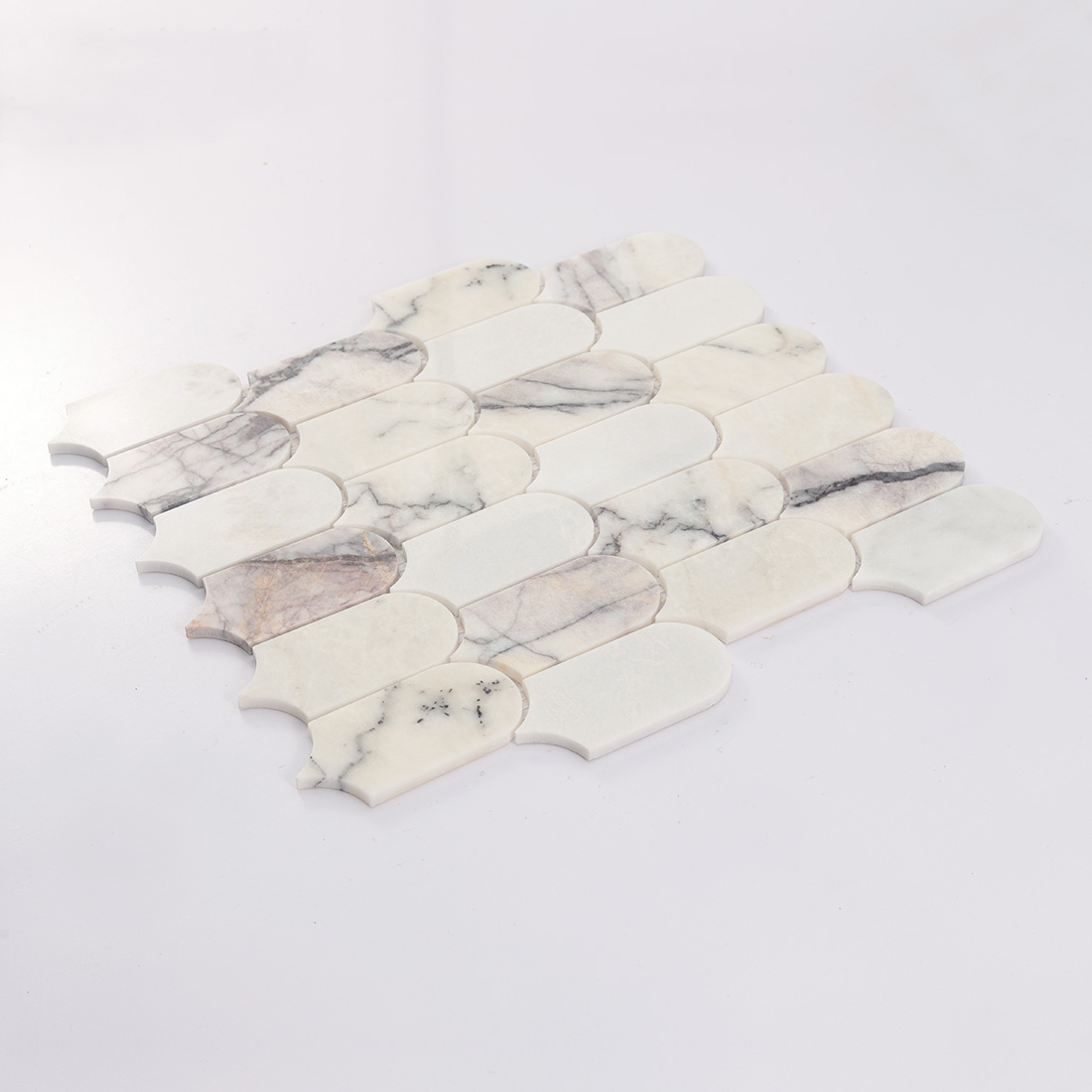 Angled white arched marble mosaic tile sheet with soft gray veining