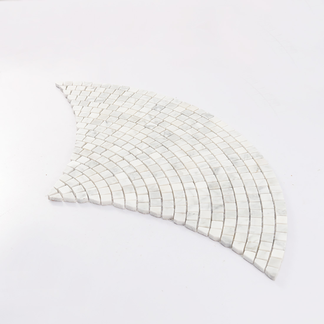 Angled view of white marble fan-shaped square mosaic sheet