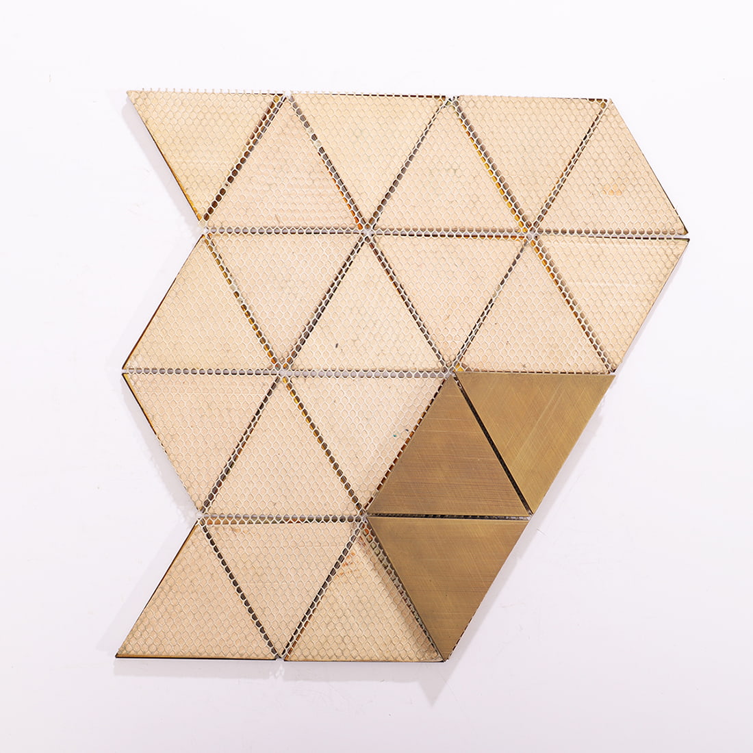 Back view of antique brass triangle metal mosaic tile with mesh backing