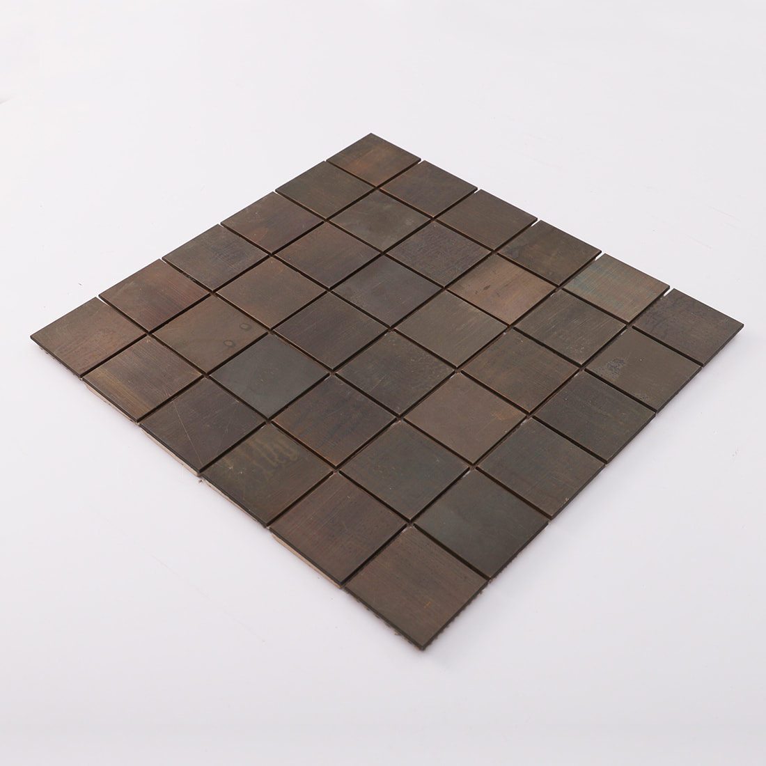 Angled sheet view of antique bronze square metal mosaic tile
