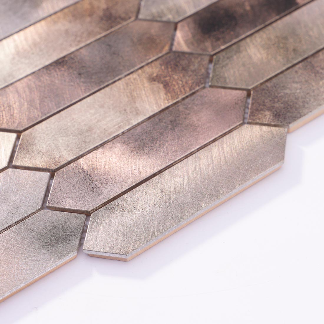 Angle shot of antique champagne gold picket aluminum mosaic tile showing edge
