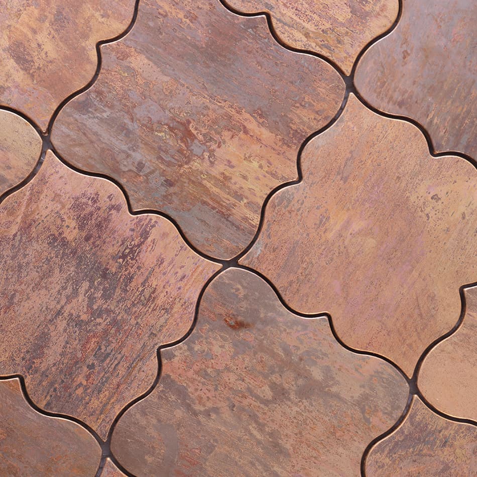 Close up of antique copper arabesque mosaic tile surface texture