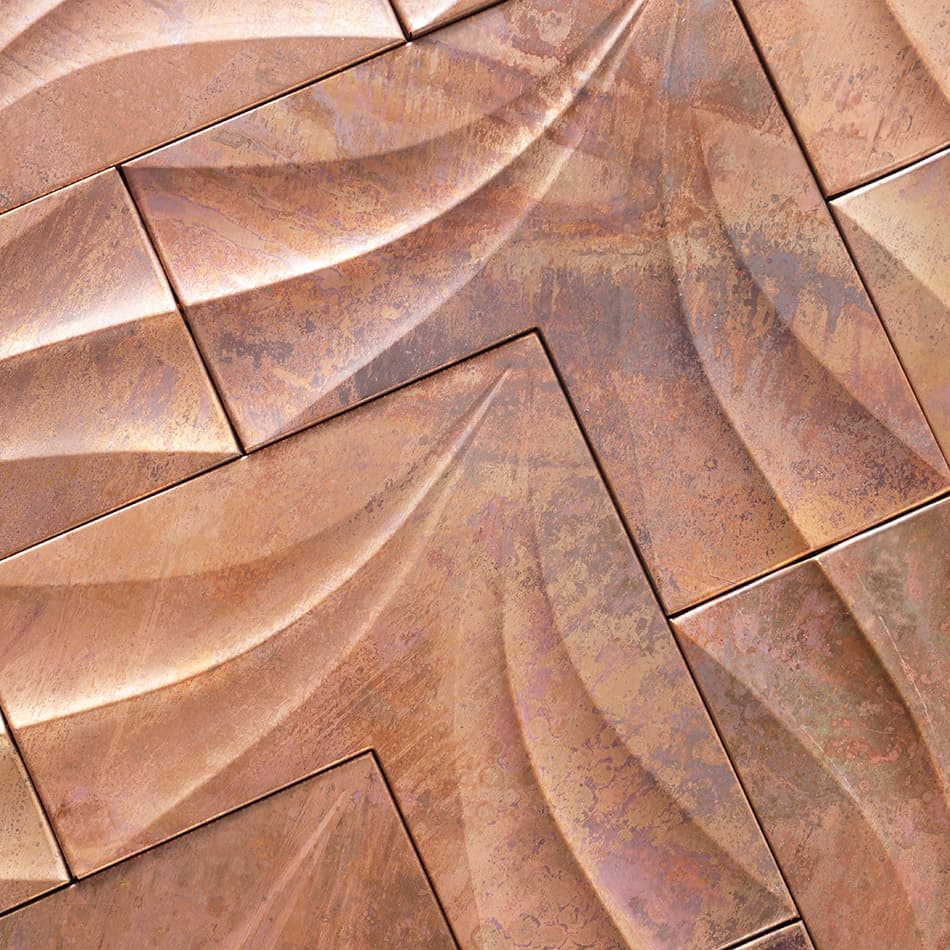 Close-up of antique copper chevron metal mosaic tile surface