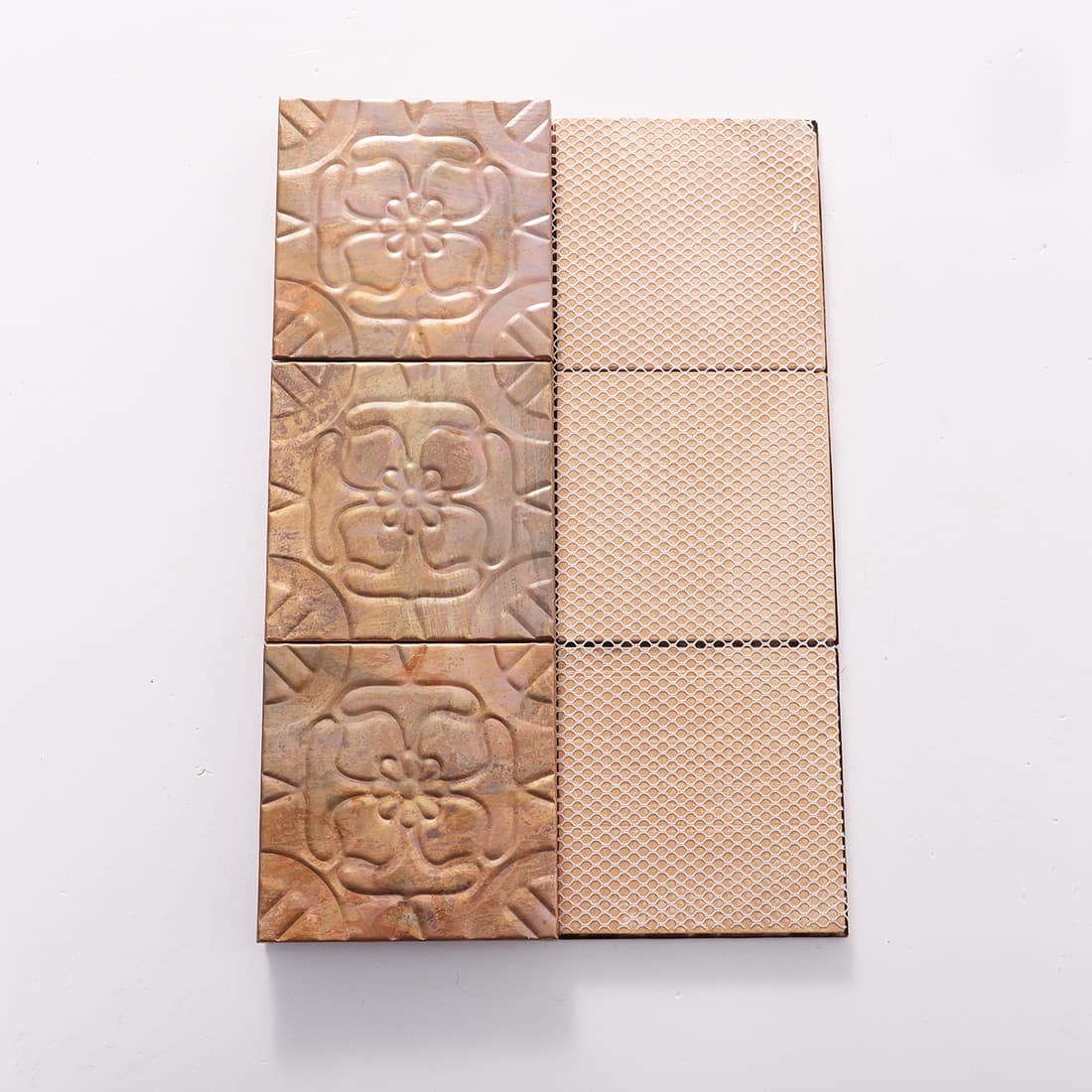 Front and mesh back view of antique copper embossed floral tiles