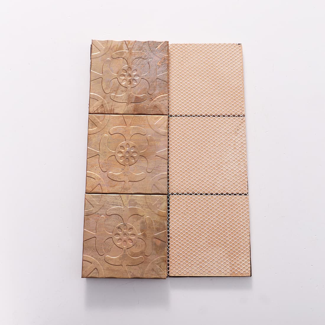 Front and mesh back view of antique copper floral embossed tiles