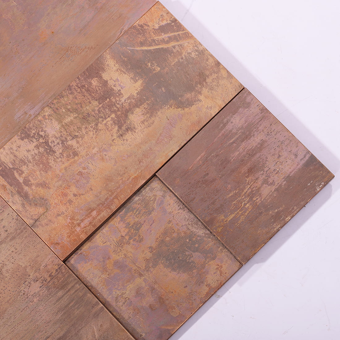 Corner detail of antique copper mixed rectangle metal mosaic tile