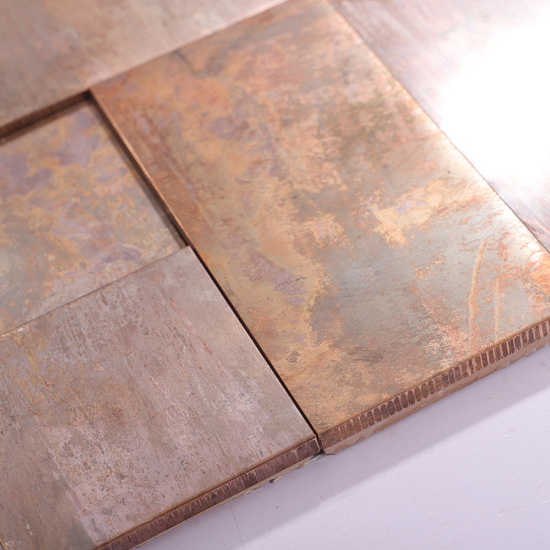 Edge detail of antique copper mixed rectangle metal mosaic tile sheet