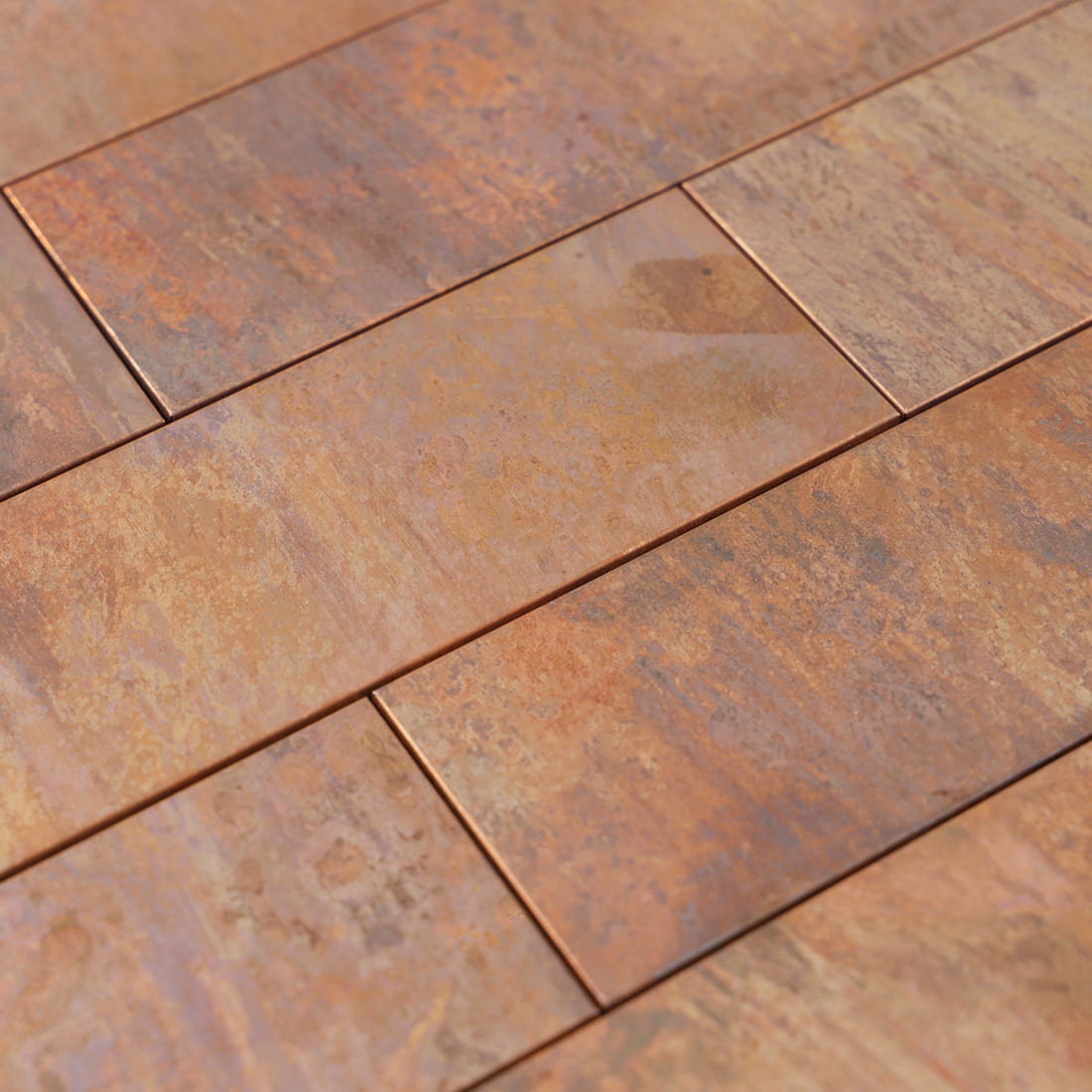 Close up of antique copper rectangular metal mosaic tile surface