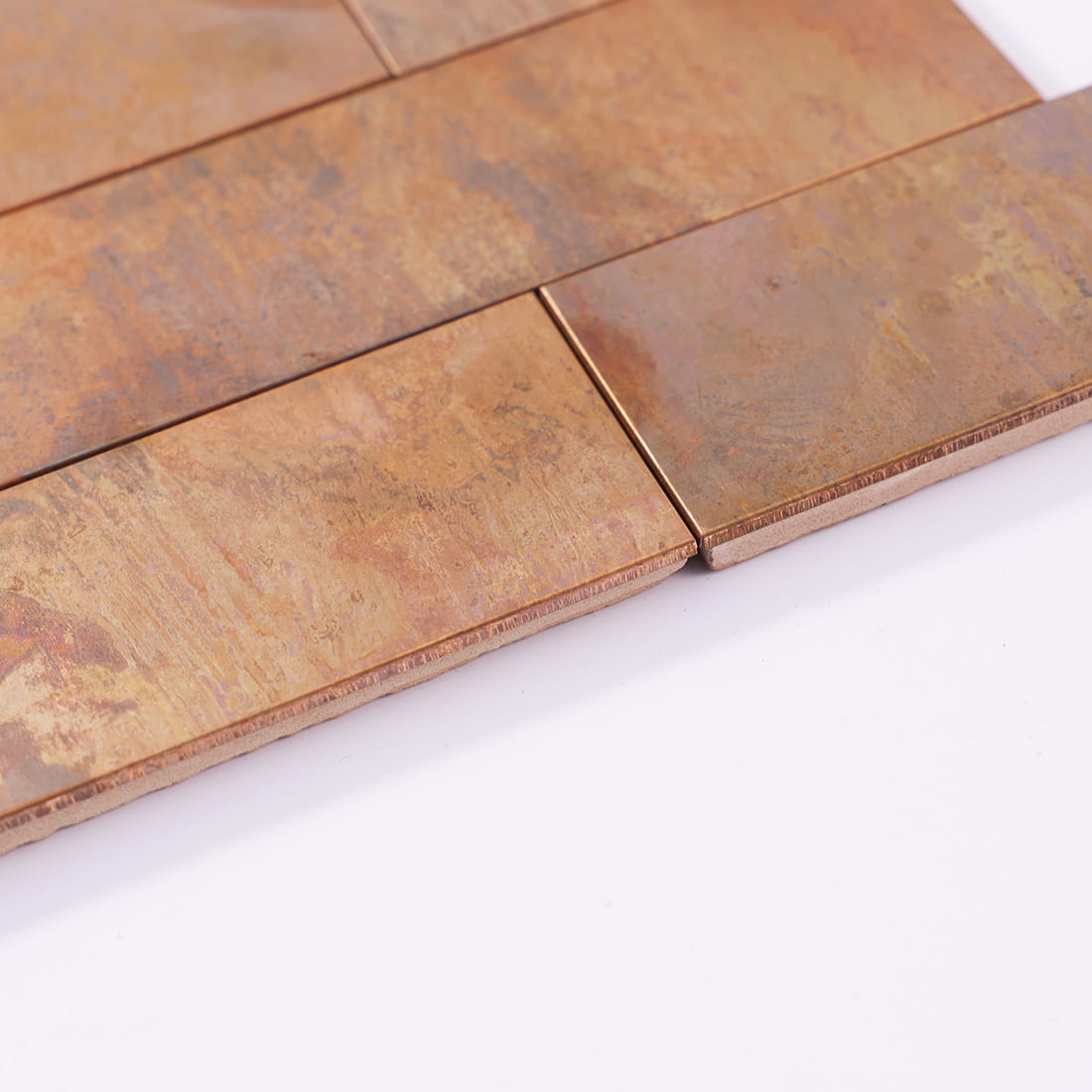 Edge view of antique copper rectangular metal mosaic tile sheet