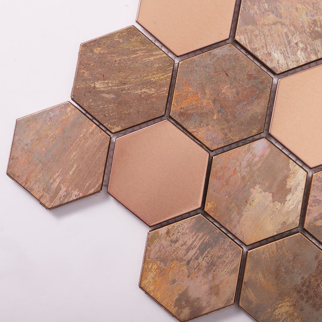 Close-up of antique copper and rose gold hexagon metal mosaic tile