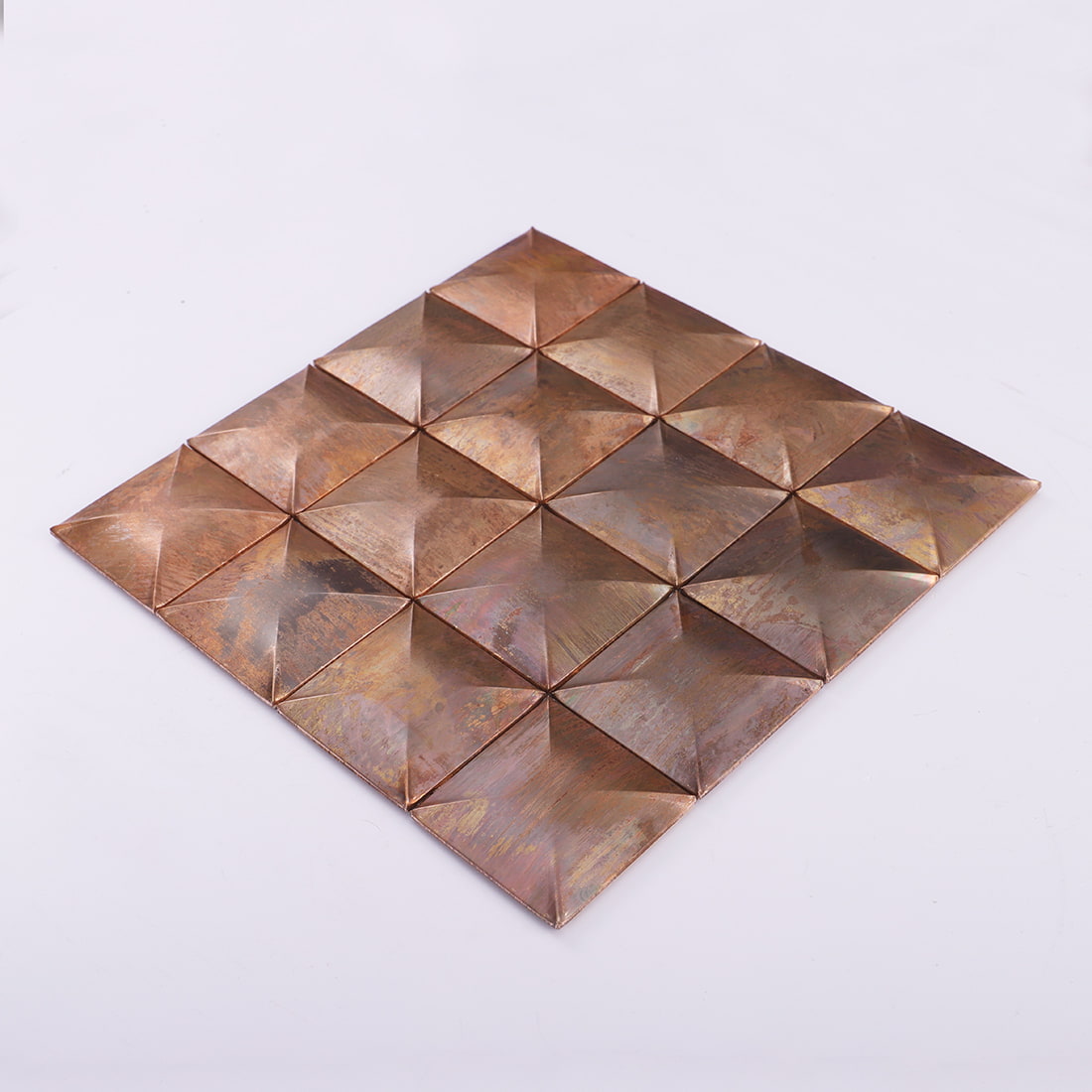 Angled sheet view of antique copper square 3D metal mosaic tile