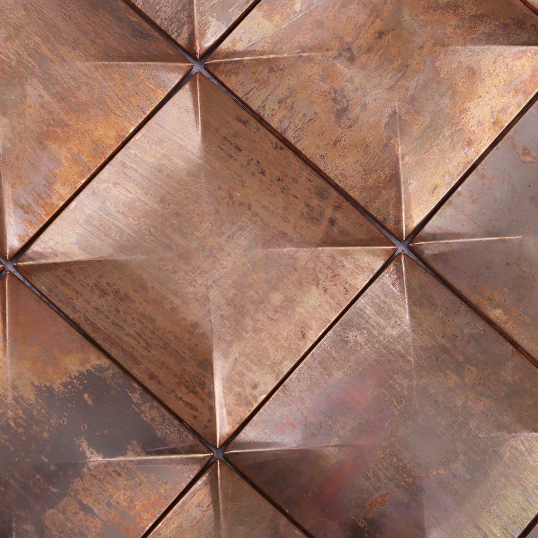 Close up of antique copper square 3D metal mosaic tile surface