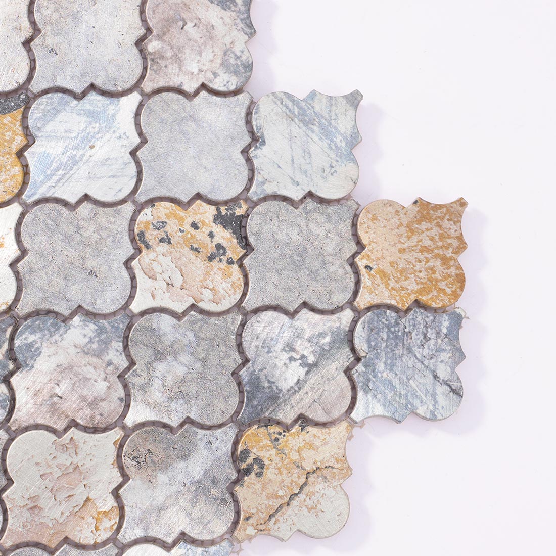 Close-up detail of arabesque lantern aluminum mosaic tile corner