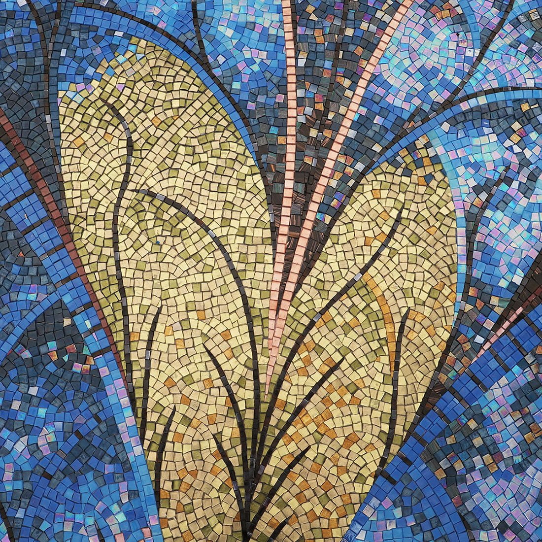 Artisanal mosaic wall mural with blue and gold leaf design for elegant interiors.