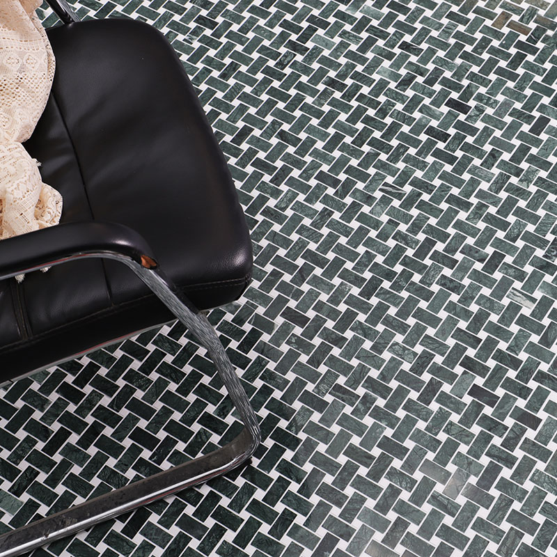 Close-up of green marble basketweave floor tiles with a diagonal woven pattern.