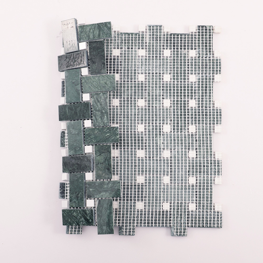 Rear view of mosaic tile showing mesh-mounted backing for installation.
