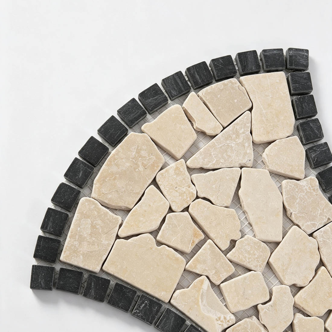 Beige pebble stone tile with dark marble border detail