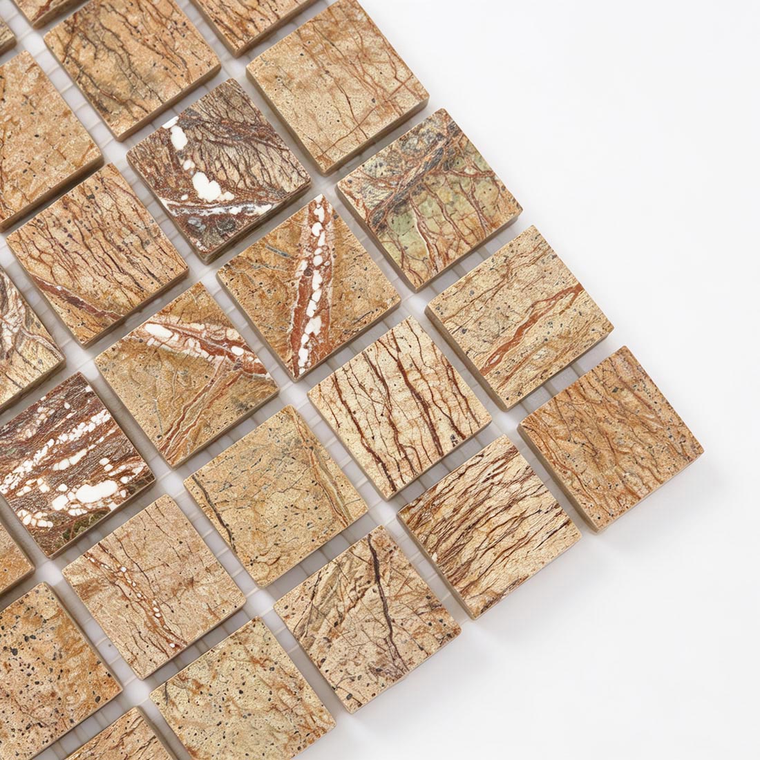 Close-up of beige and brown square marble mosaic with distinctive natural veining