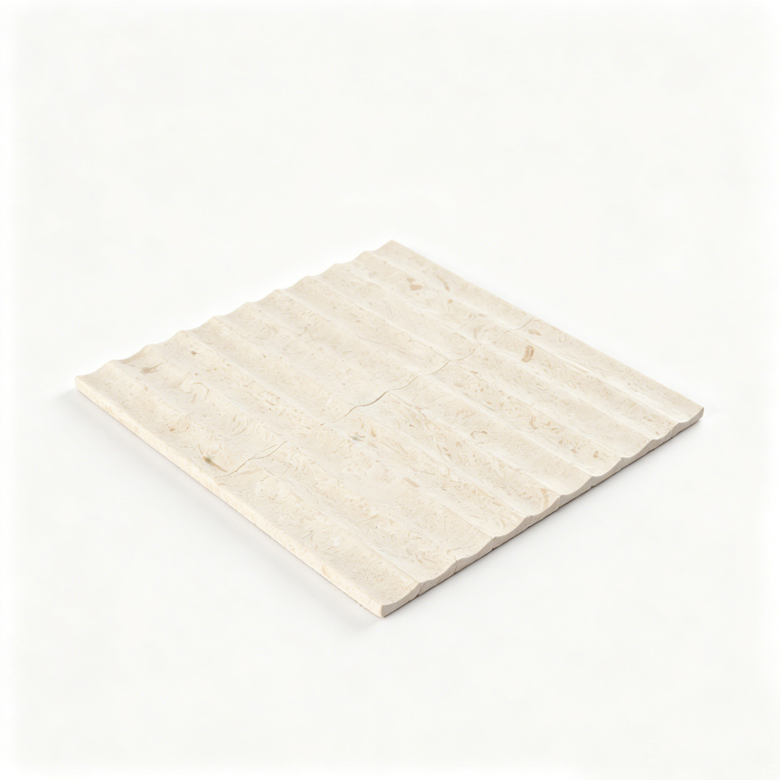 Angled perspective of seamless beige limestone fluted decorative tile.