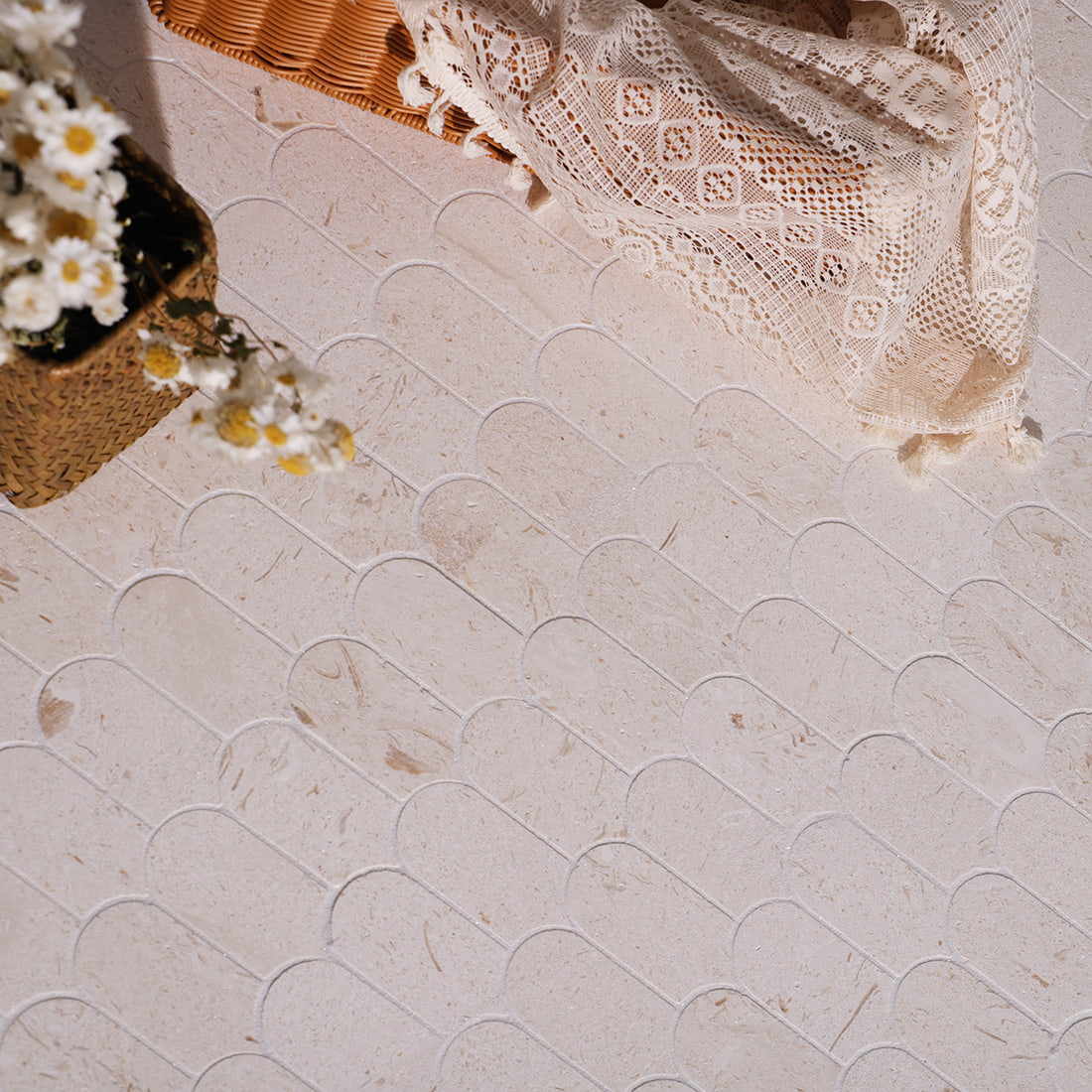 Beige marble scallop mosaic tile floor scene with lace cloth