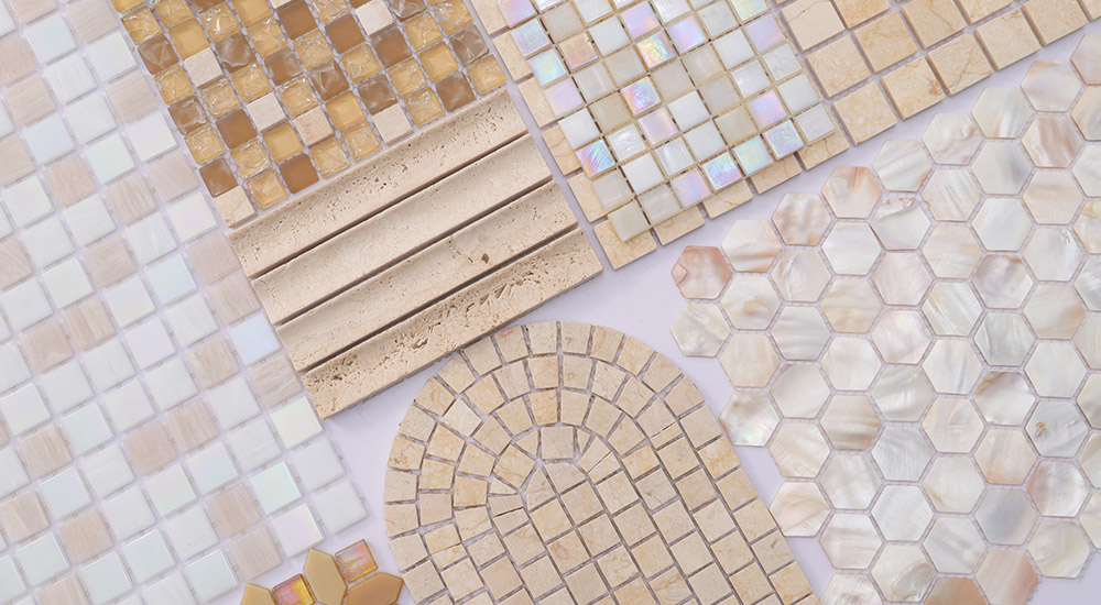 {"default":"Beige tiles in assorted patterns including marble arches, glass, and shell hexagon mosaics."}

